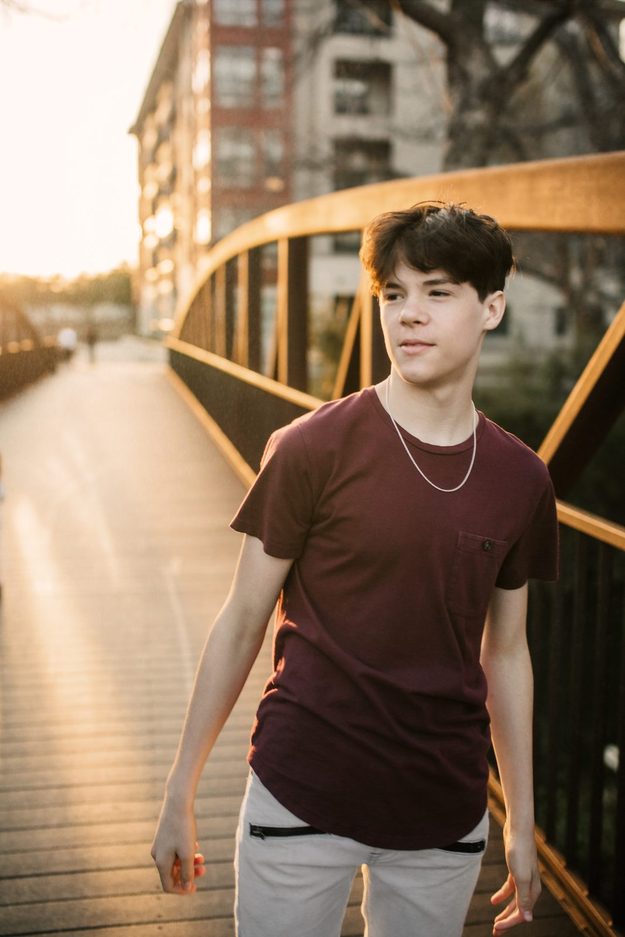 Senior on a bridge in evening light