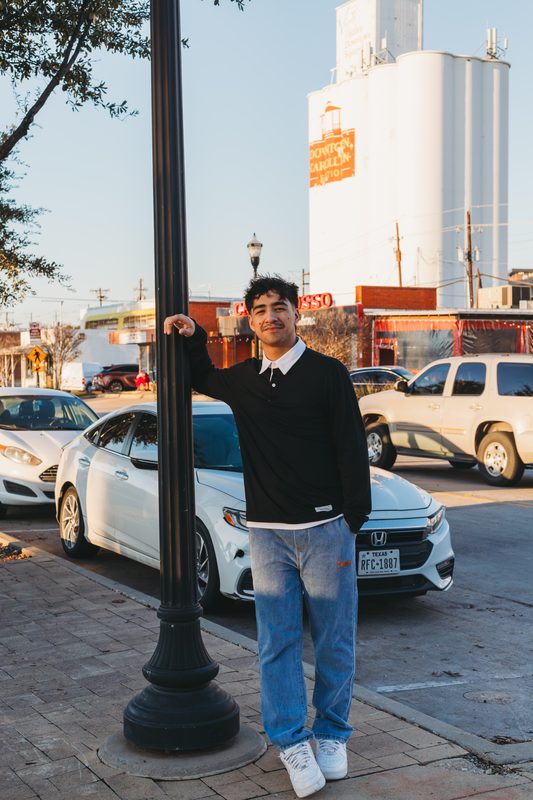 Senior by a lamppost downtown
