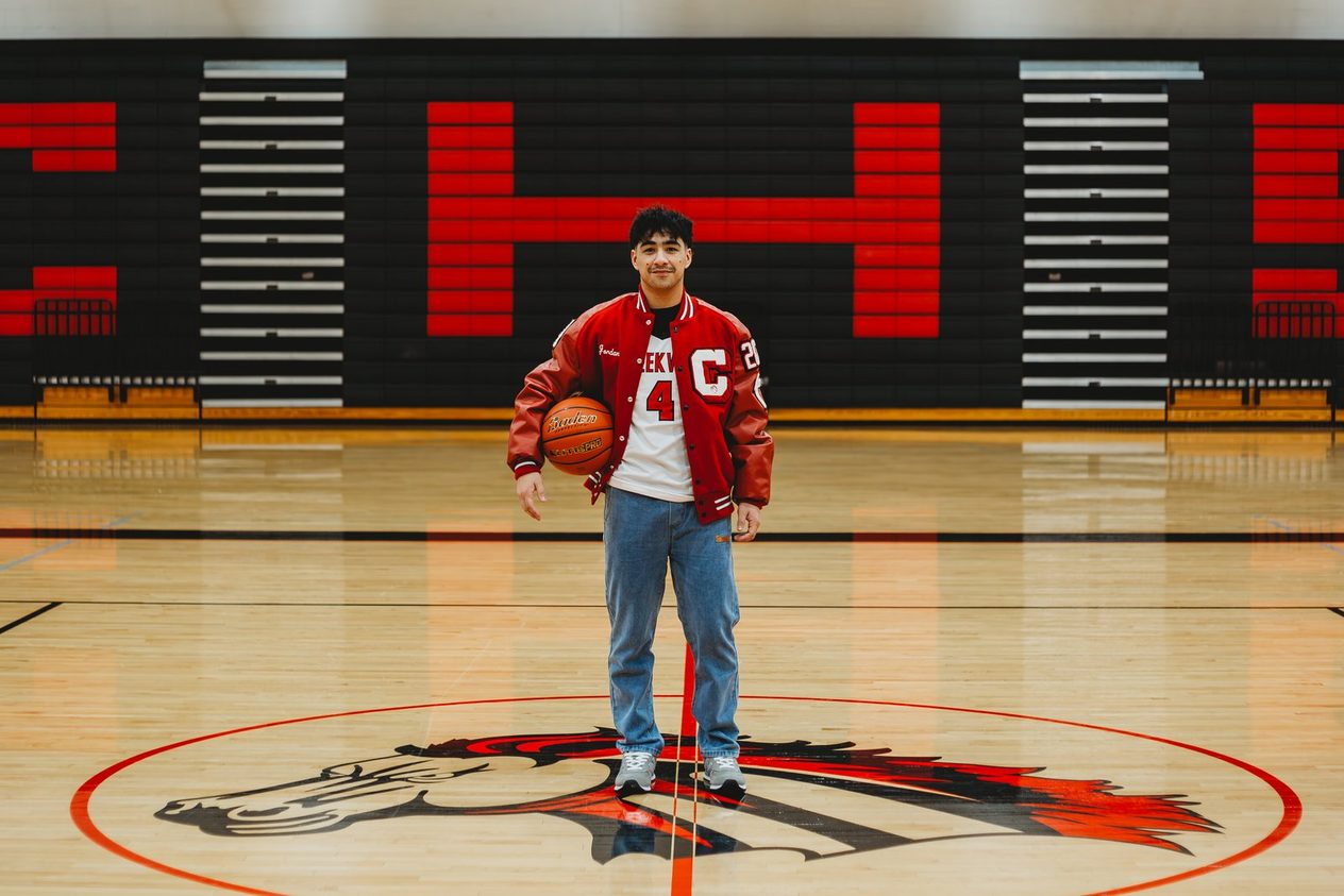 Senior at centre court in his letter jacket