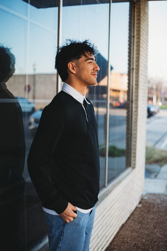 Senior at a glass storefront