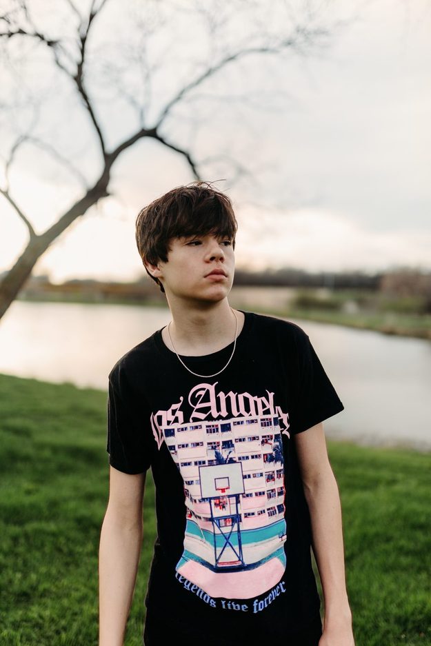 Senior in a graphic tee by the water