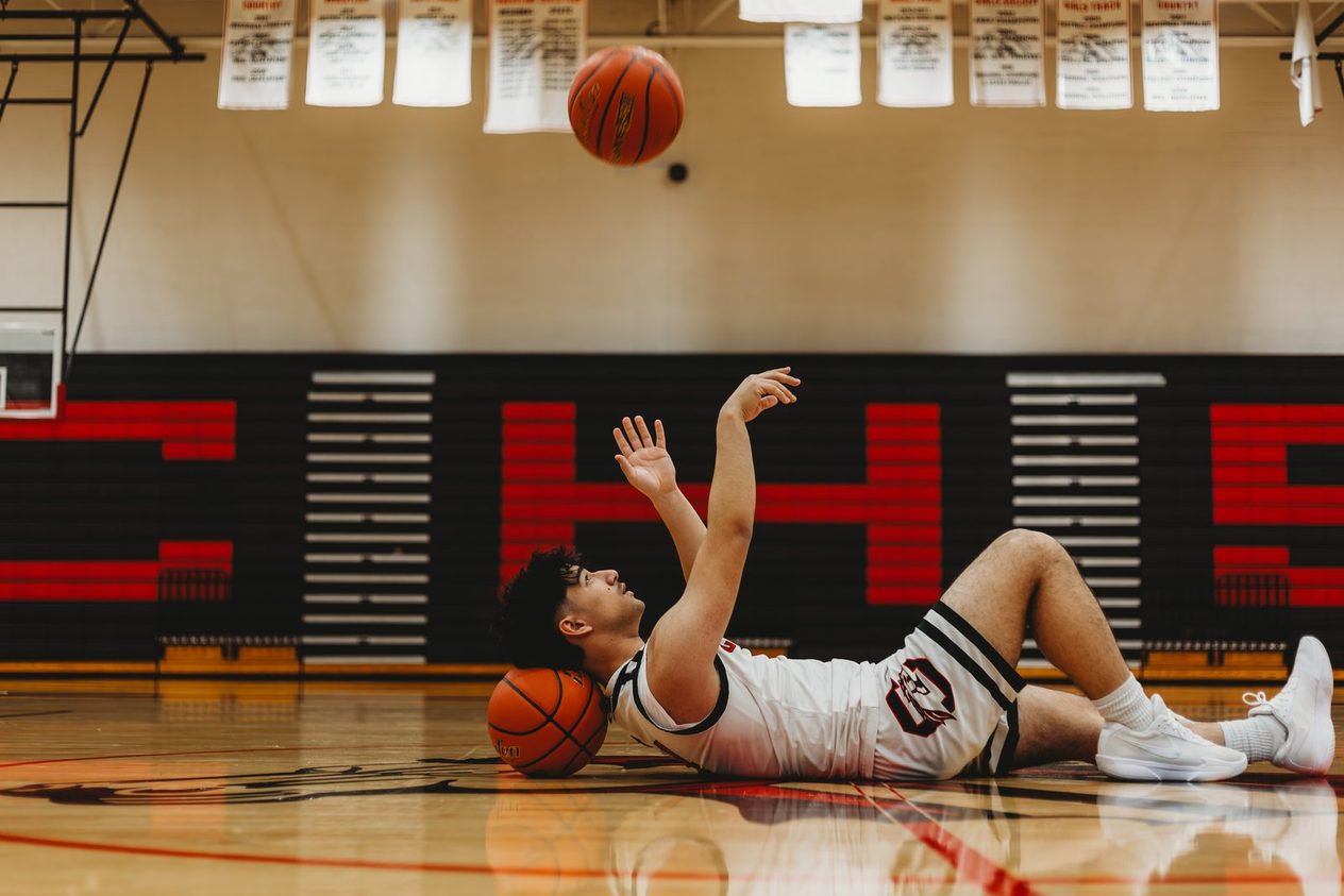 Senior lying on the gym floor