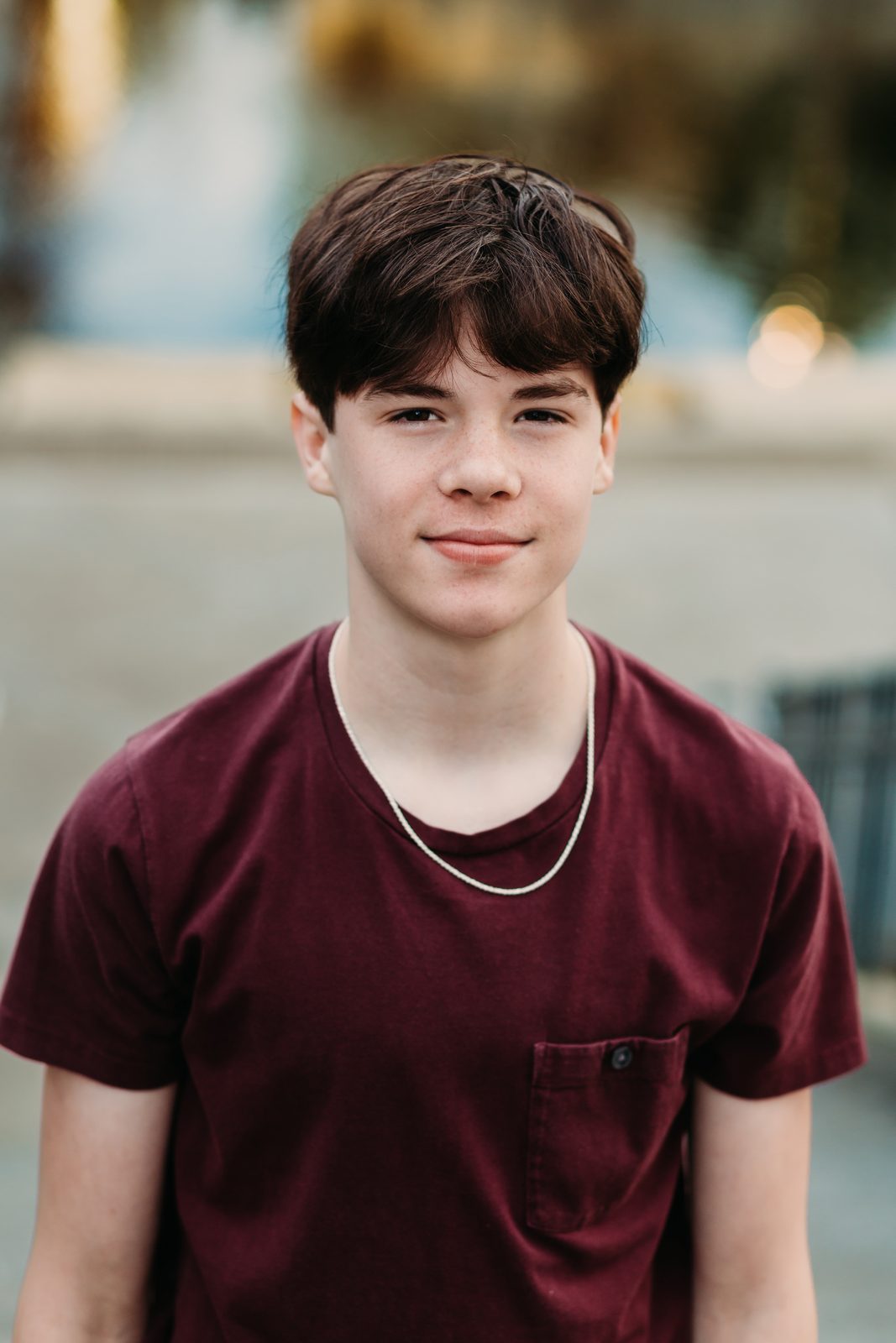Senior portrait in a maroon tee