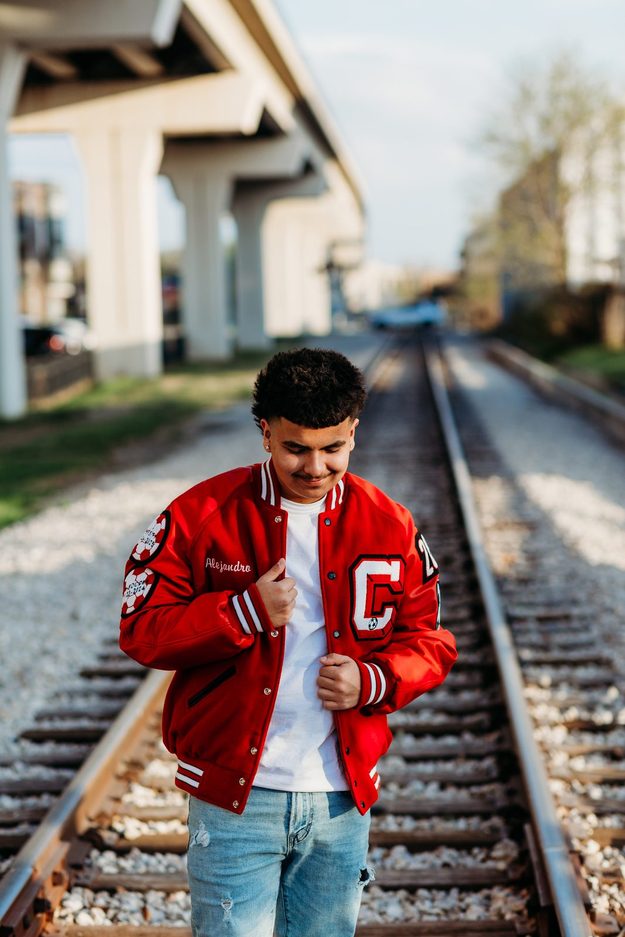 Senior on rail tracks under an overpass