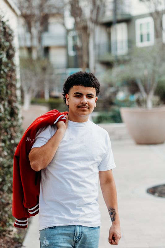 Senior with his jacket over one shoulder